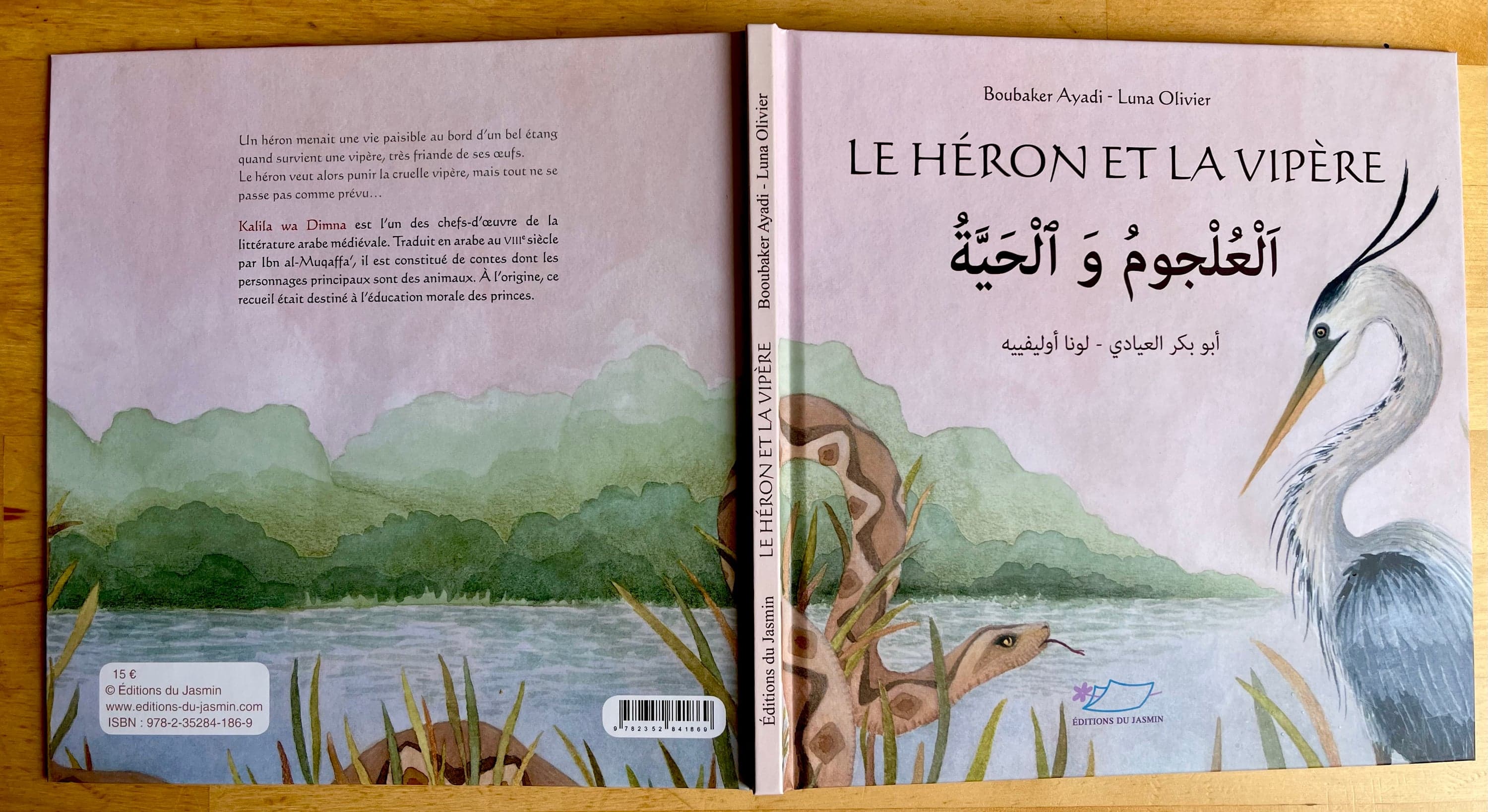 Illustration of Luna Olivier, from her project Le héron et la vipère. A photography of the book cover, front and back, showing the heron and the viper by the pond.